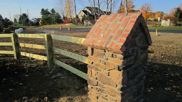 Custom designed, stone fence creates a natural boundary