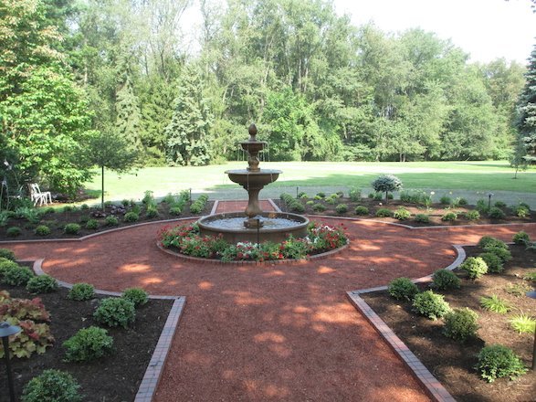 Planting beds and symmetrical patterns add a dynamic element to this landscape