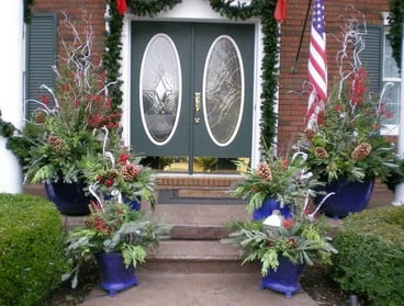 An outdoor space features seasonal containers for added flexibility and customization options.