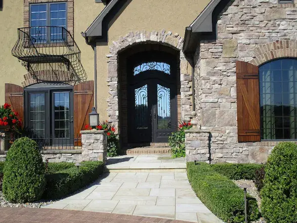 Adding plants and stone to existing landscape